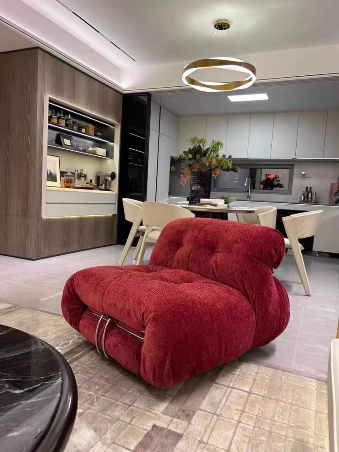 Designer sculptural lounge chair styled in contemporary living space