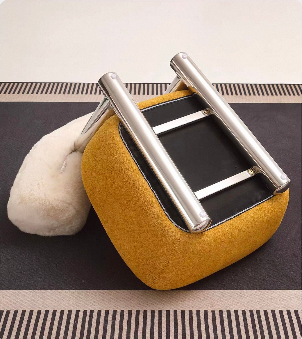 Pipe sculptural armchair with upholstered seat and stainless steel base