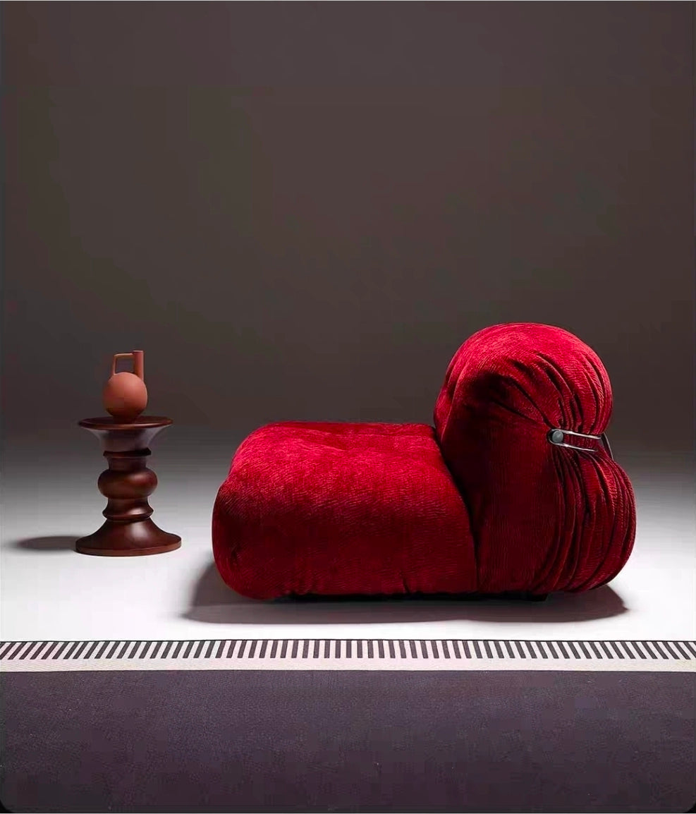 Italian-inspired designer accent chair with wrapped sculptural form
