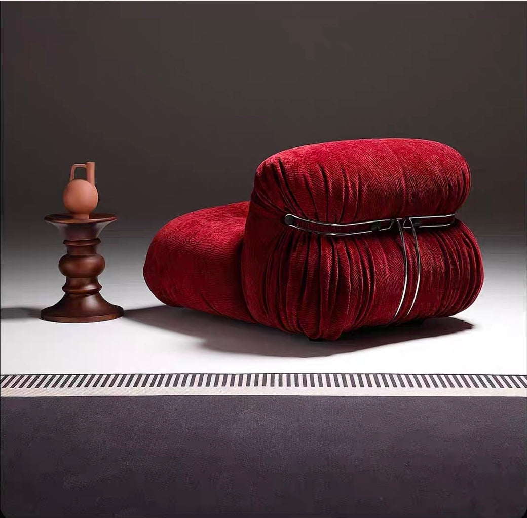 Rear view of sculptural accent chair with integrated steel structure

