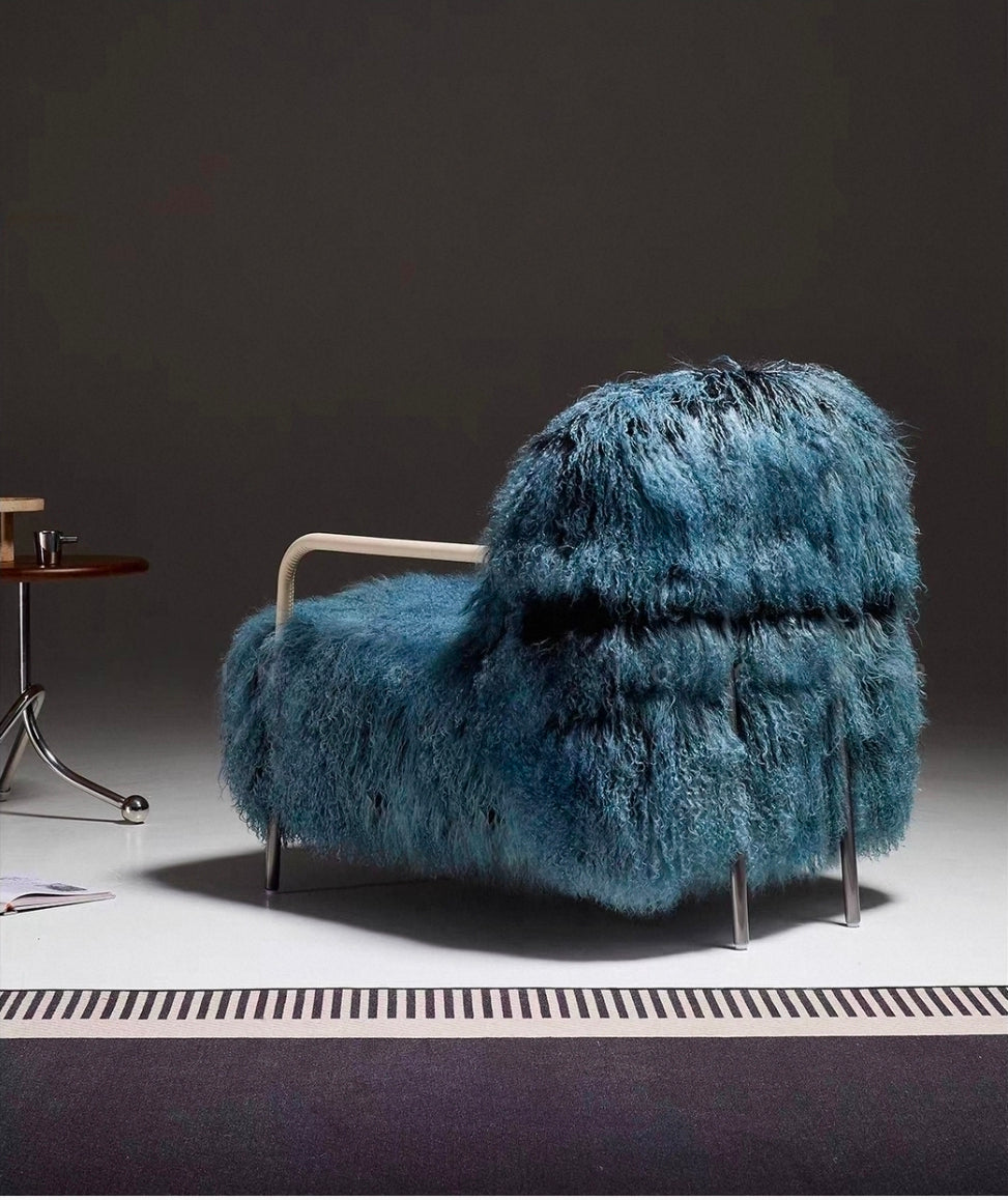 Rear view of modern shearling accent chair with stainless steel structure
