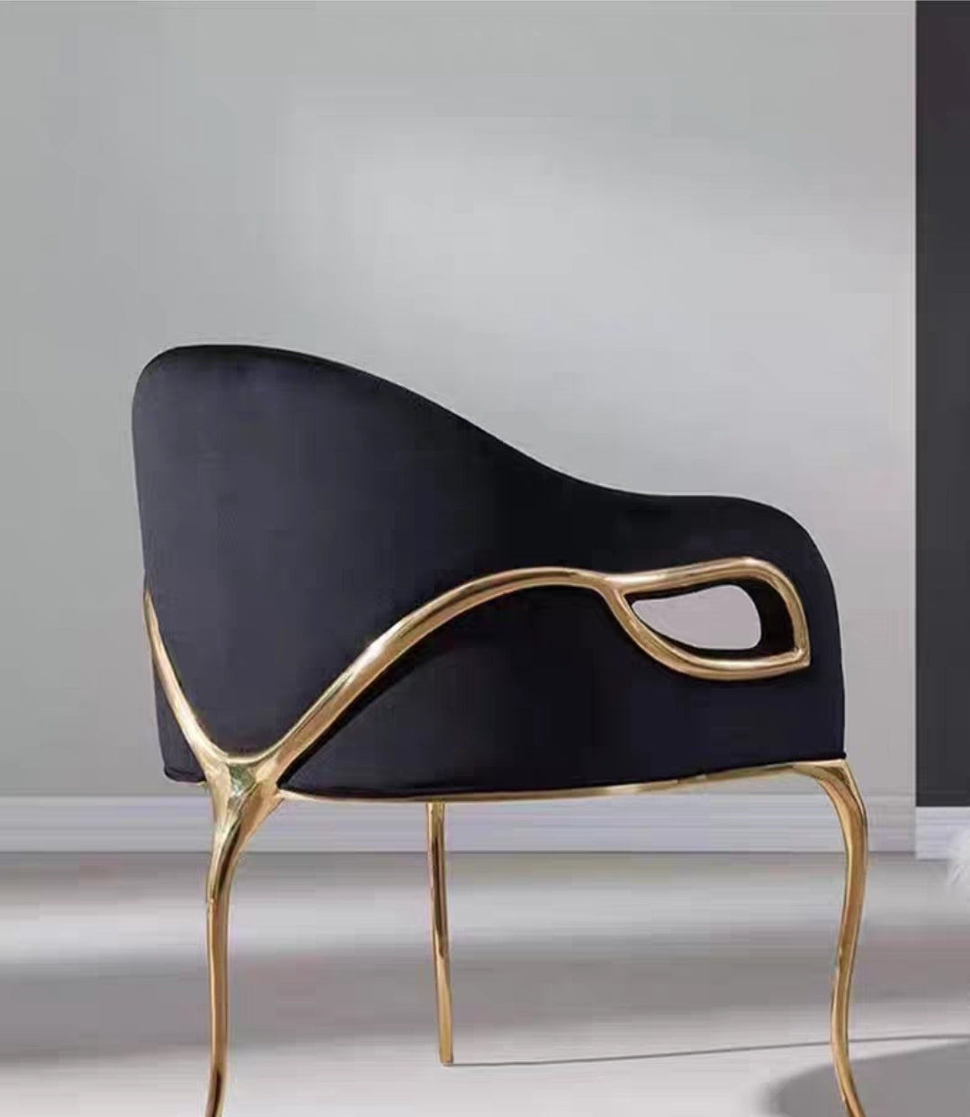 Curved brass-framed designer chair, exclusive atelier edition